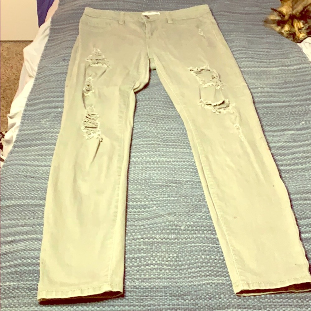 Olive colored ripped jeans